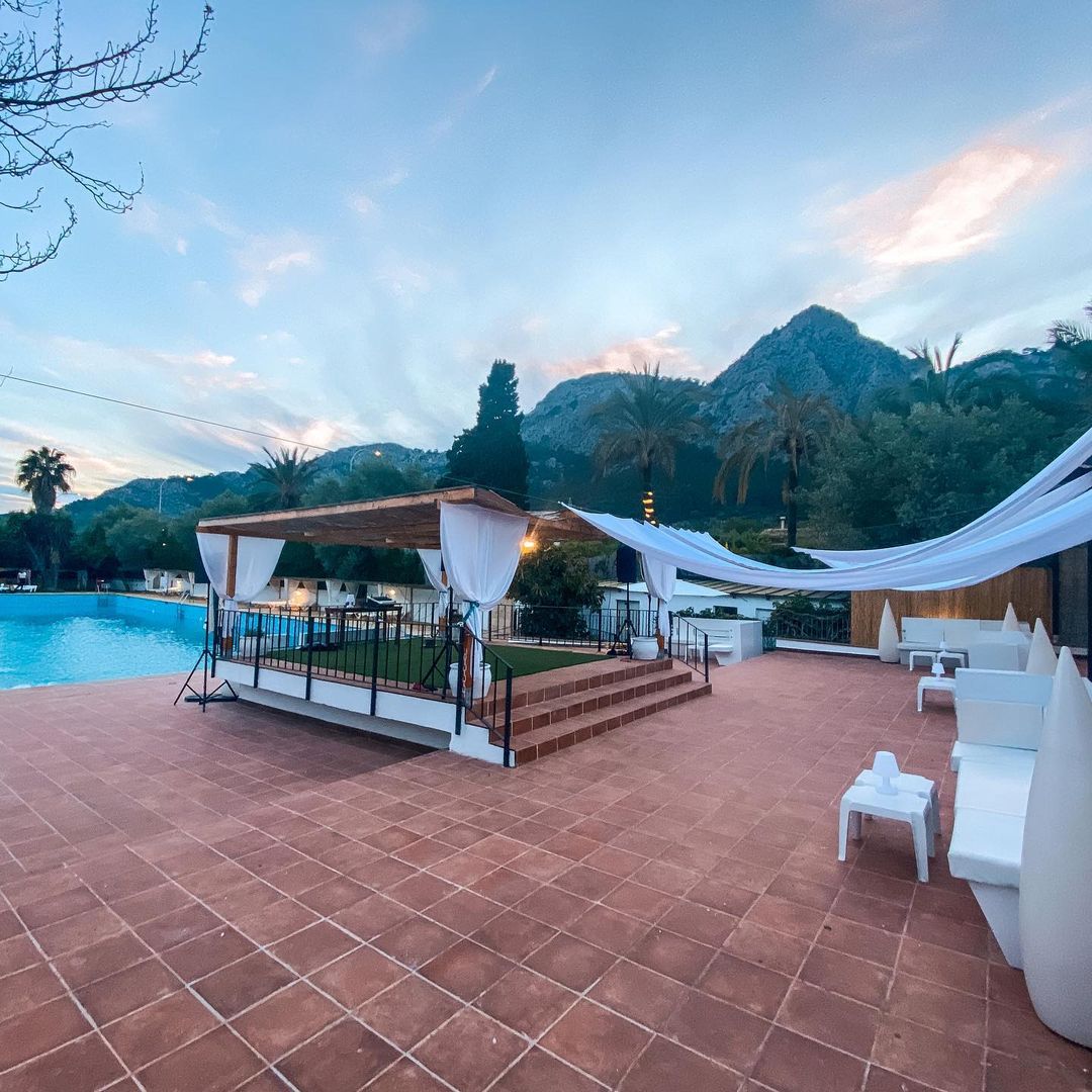 Evening event terrace with gazebo and mountain backdrop