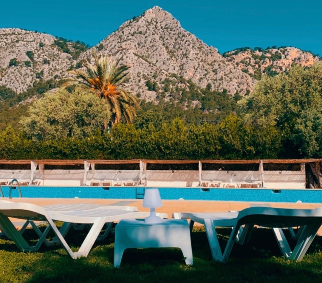 Swimming pool with sun loungers and Serra de Tramuntana views